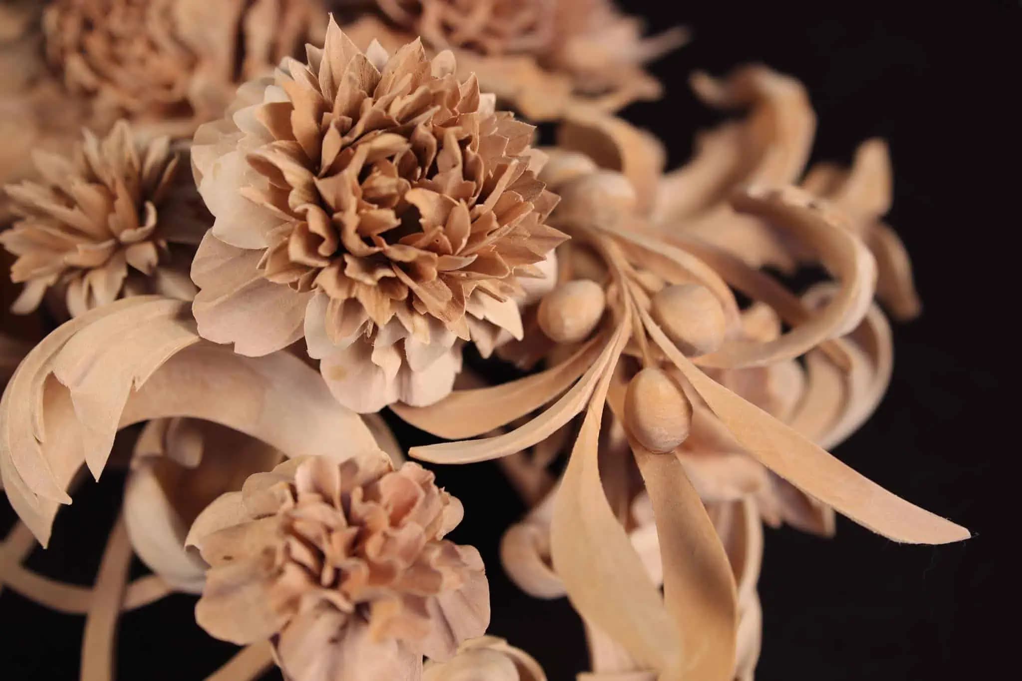 Blooming peonies and leaves in limewood, a custom wood carving by Alexander Grabovetskiy.
